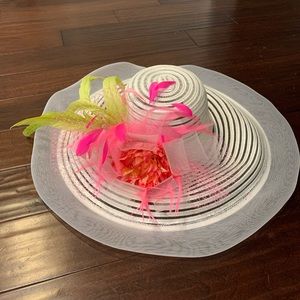 Large White base with large pink flower and green and pink feather accents